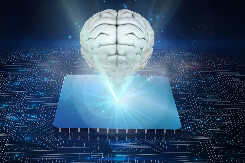 Composite image of brain with electronic systems background